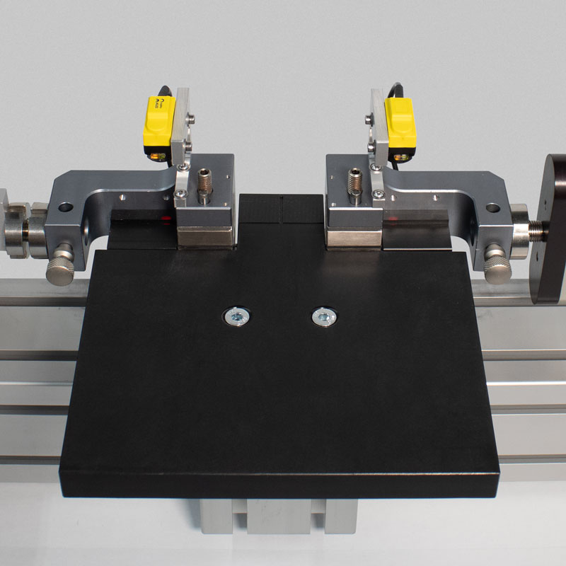 Low-friction pneumatic loading fixture with sample alignment sensors